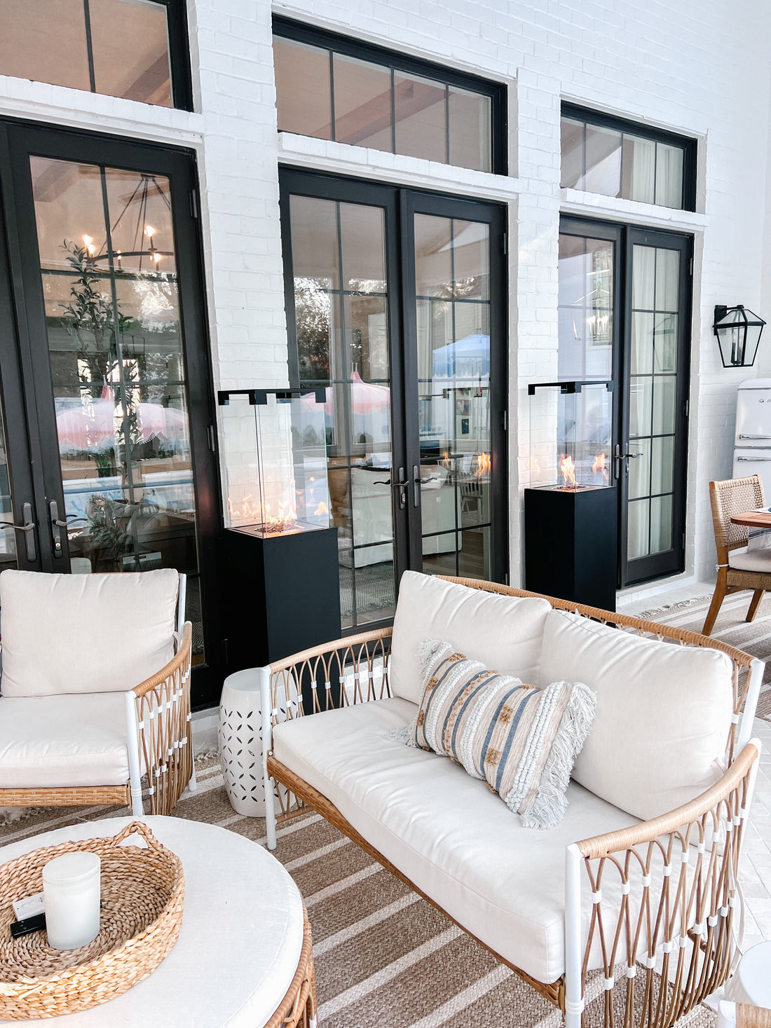 Faro design patio heaters with visible flame on a patio