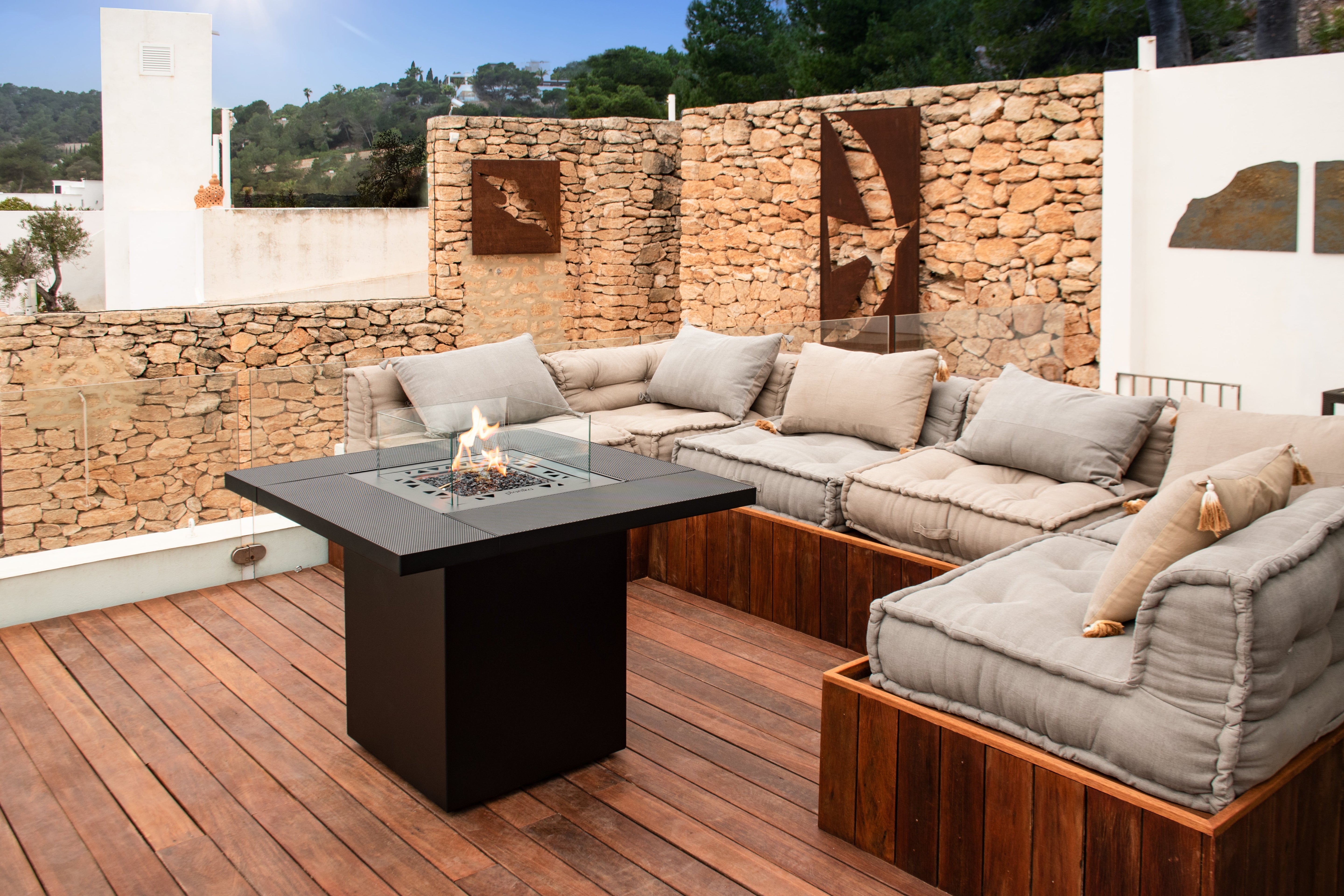 Planika Square Table fire pit table on a terrace