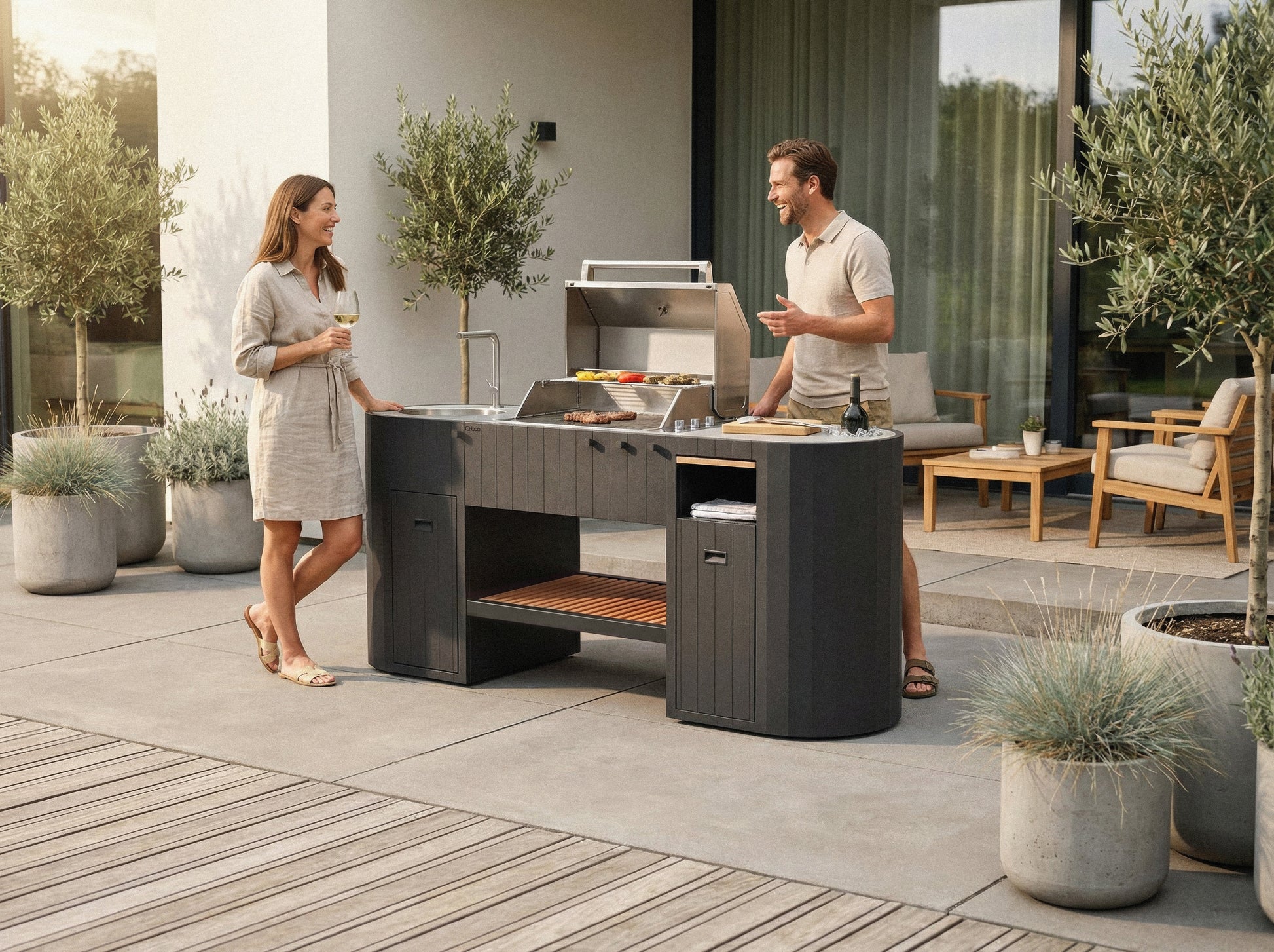 Friends grilling on the OVO outdoor kitchen with the OVO Grill 3B