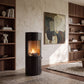 Cozo FLOGS bioethanol stove in a bright living room with a curved sofa and bookshelves – interior visualisation